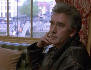 John in leather jacket, in the pub.