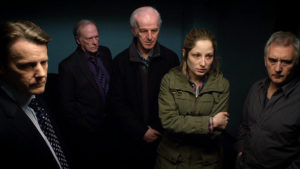 Strickland, Gerry, Ken, Georgia and Steve look into the interrogation room