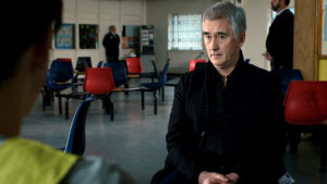 Steve, looking sceptical, in the greeting area at the prison