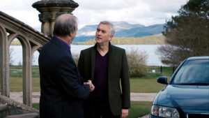 Steve and Gerry outside the golf club. There is a beautiful scottish vista in the distance